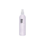 A bottle of Edelstein Eco Hairspray with a pump dispenser, predominantly purple in color.