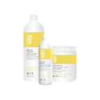 A set of three professional curly haircare products labeled 'TREND UP', including a shampoo, mask, and defining fluid, in salon-sized containers.