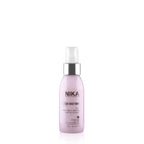A pink spray bottle labeled Nika Age Restore with hyaluronic acid for hair care.