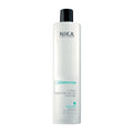 A bottle of Nika Ultimate Keratin Treatment for hair care.
