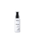 A white spray bottle with a black pump labeled Nika Fairy Silk extender, designed for hair care.