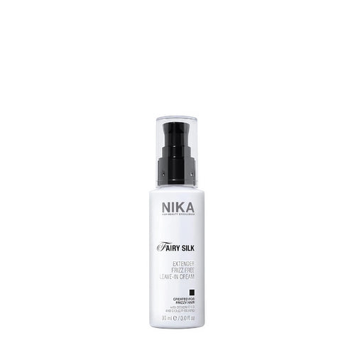 A white spray bottle with a black pump labeled Nika Fairy Silk extender, designed for hair care.