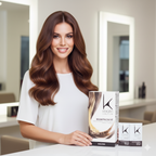 Woman with long, wavy hair holding a Kerastase product in a salon setting